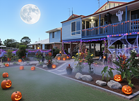 Give a Halloween landscaping design for this space and house 