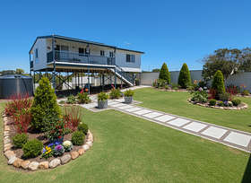 That's a beautiful, expansive front yard. A successful winter landscaping design for this space w...
