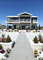 Winter season: A landscaping design for this space and house. 15 cone trees. 35 flowers along the...
